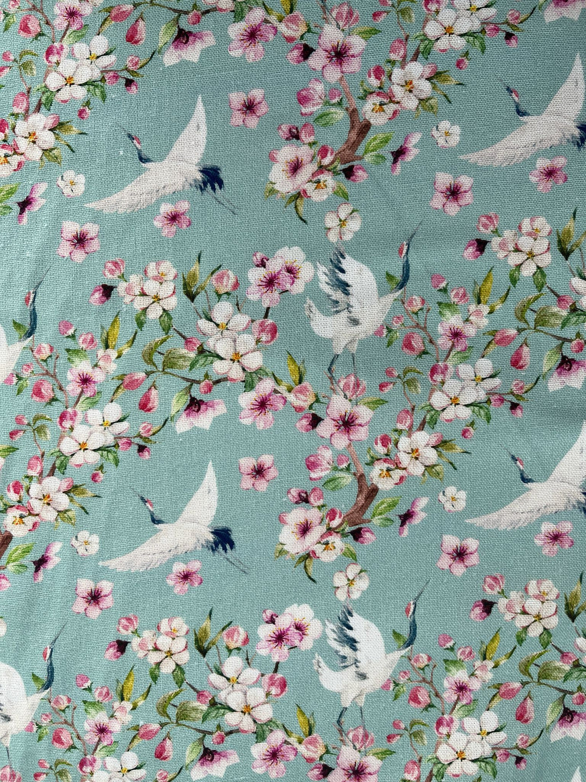 Floral pattern with birds on a teal background