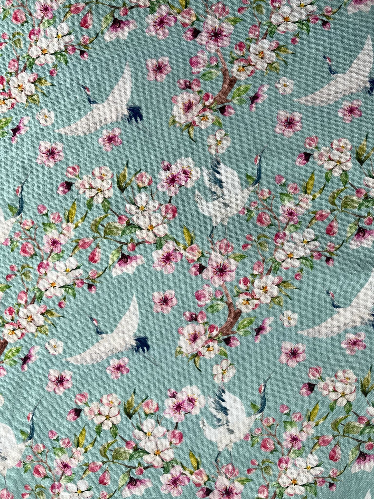 Floral pattern with birds on a teal background