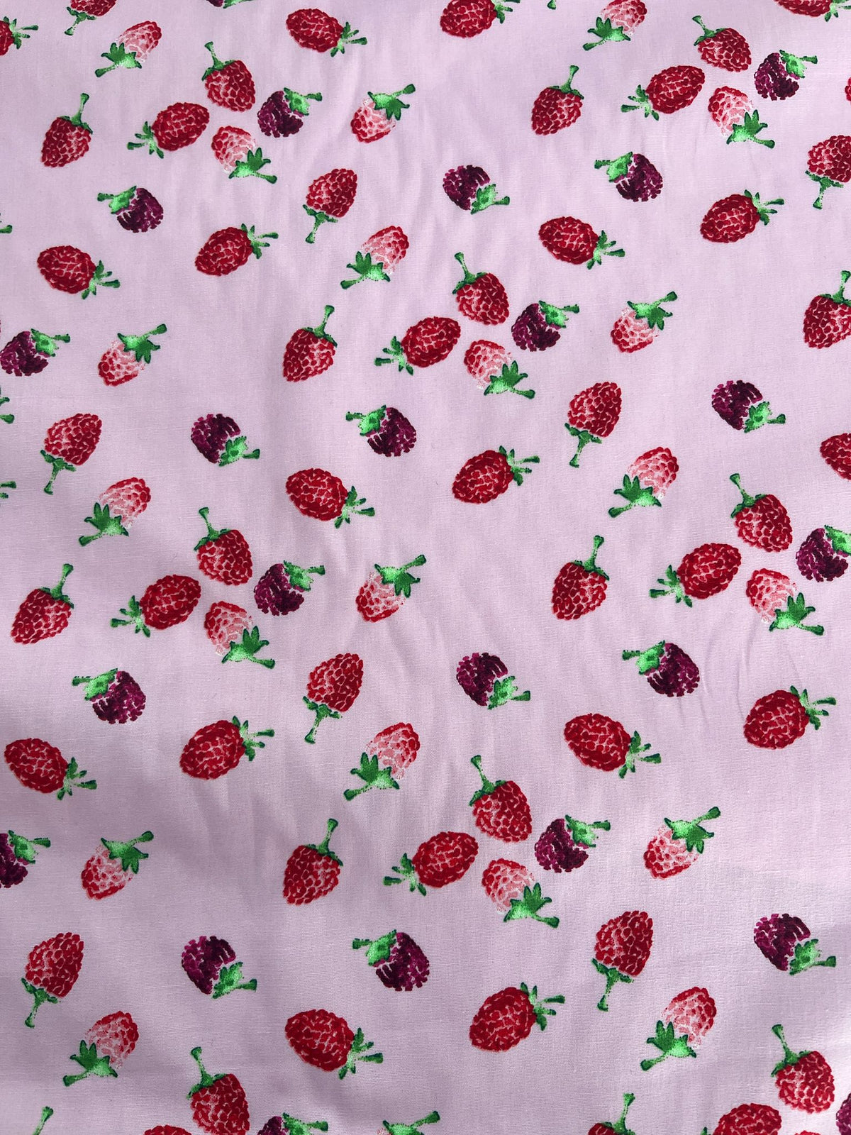 Pattern of strawberries on a light purple background