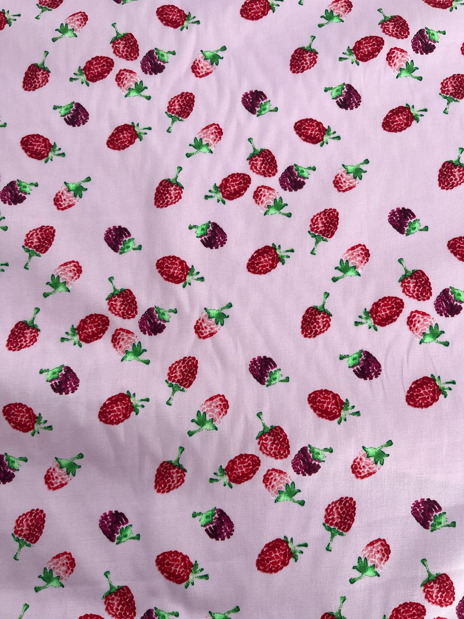 Pattern of strawberries on a light purple background