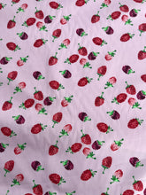 Pattern of strawberries on a light purple background